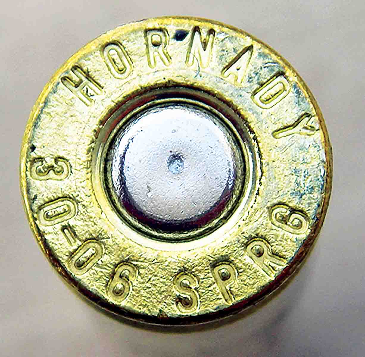 This live primer shows the typical indention by the floating firing pin that occurs when loaded cartridges are slammed hard into the chamber of a M1 Garand. To prevent dangerous slam-fires, Brian strongly suggests using the MIL-SPEC CCI No. 34 primer that is engineered to be less sensitive and designed specifically for this application.